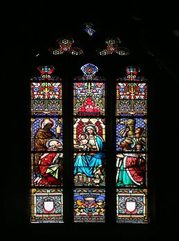 Nativity Scene, Adoration of the Magi, stained glass window in parish church of Saint Mark in Zagreb, Croatia