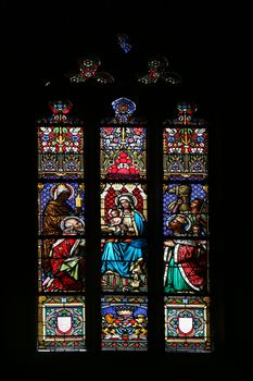 Nativity Scene, Adoration of the Magi, stained glass window in parish church of Saint Mark in Zagreb, Croatia on November 21, 2014