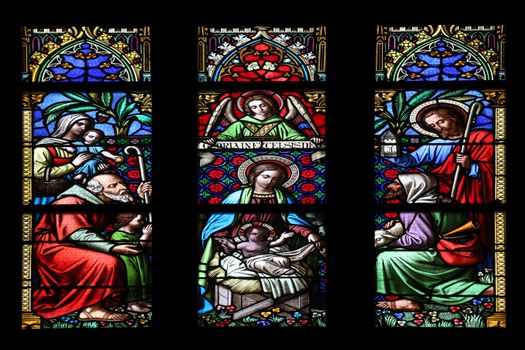 Nativity Scene, Adoration of the Shepherds, stained glass window in parish church of Saint Mark in Zagreb, Croatia