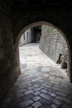 Ancient arch pathway on a Kotor old town in Montenegro