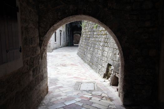Ancient arch pathway on a Kotor old town in Montenegro