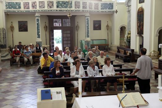 Mass for pilgrims in the Catholic Church Saint Eustache in Dobrota, Montenegro