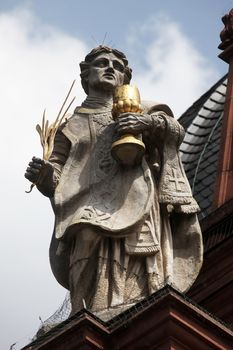 St. Totnan on the Facade of Neumunster Collegiate Church in Wurzburg