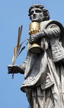 St. Totnan on the Facade of Neumunster Collegiate Church in Wurzburg