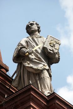 St. Colman on the Facade of Neumunster Collegiate Church in Wurzburg