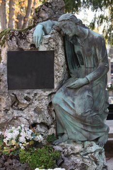 Detail of a mourning sculpture on a Mirogoj cemetery in Zagreb, Croatia