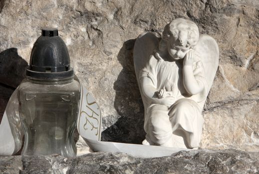 A white mourning porcelain angel at Mirogoj cemetery, Zagreb, Croatia
