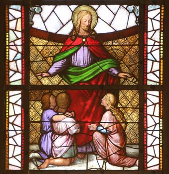 Jesus friend of children, stained glass window in the Church of St. Vincent de Paul in Zagreb, Croatia
