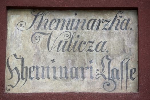 Ancient street name sign in the Upper Town of Zagreb, Croatia. Restorers have uncovered archaic bilingual street names long hidden under layers of plaster.