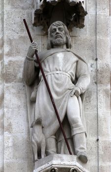 Statue of Saint Roch on the portal of the cathedral dedicated to the Assumption of Mary in Zagreb
