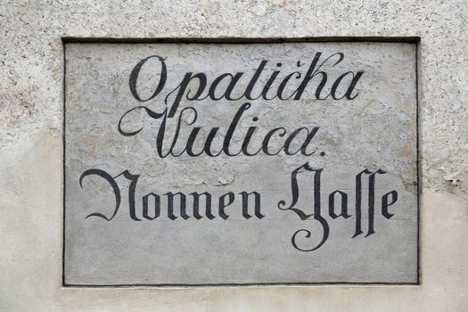 Ancient street name sign in the Upper Town of Zagreb, Croatia. Restorers have uncovered archaic bilingual street names long hidden under layers of plaster.
