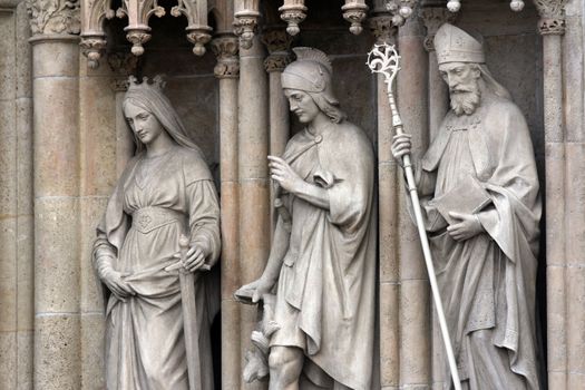 Statue of Saints Catherine, Florian, Cyril on the portal of the cathedral dedicated to the Assumption of Mary in Zagreb