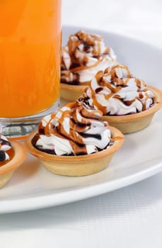 сakes filled jam with cream and topping chocolate, caramel