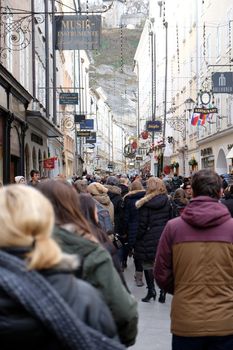 A lot of people visit the popular street of Salzburg, the Getreidegasse before Christmas. Salzburg, Austria