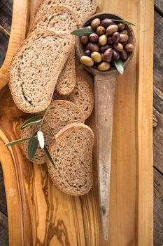 Aperitif made of bread with mixed olives in brine of Tuscany Italy
