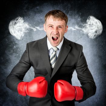Closeup portrait of angry man, blowing steam coming out of ears. Negative human emotions