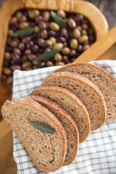 Aperitif made of bread with mixed olives in brine of Tuscany Italy
