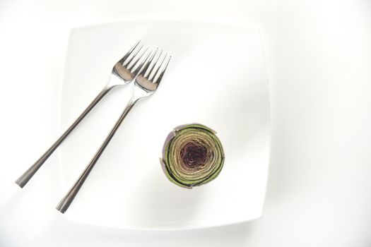 Presentation of a side dish made of fresh artichokes
