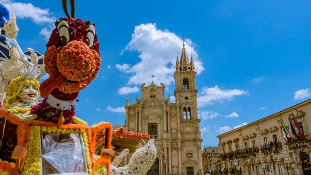 the puppet smiling flower in a Sicilian square