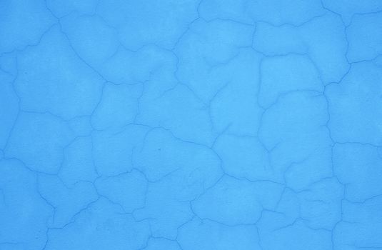 Texture of outside blue stucco wall of a house.