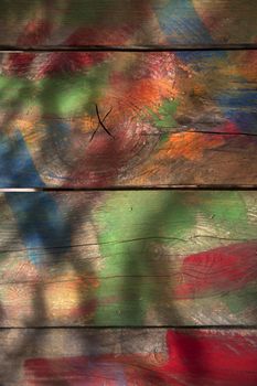 Background of wooden boards colored with mixed colors
