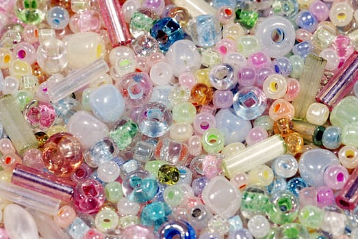 Macro shot of colorful beads of different colors, shapes, and sizes used in making jewelry or crafts.  Great as background.