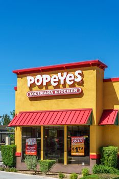 PALMDALE, CA/USA - APRIL 23, 2016: Popeyes Louisiana Kitchen exterior. Popeyes Louisiana Kitchen is an American chain of fried chicken fast food restaurants.