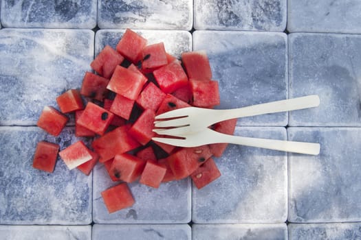 Presentation of a summer dish made of diced watermelon 