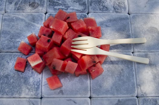 Presentation of a summer dish made of diced watermelon 