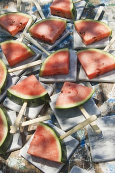 Presentation of a summer dish made up of slice of watermelon 