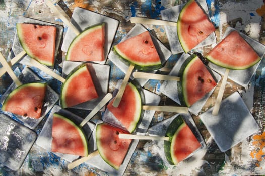 Presentation of a summer dish made up of slice of watermelon 