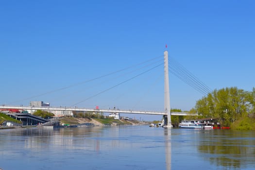 The pedestrian cable-stayed bridge on the Tura River in the city of Tyumen, Russia. May, 2016