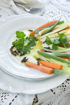 Preparation and presentation of mixed vegetables for garnish 