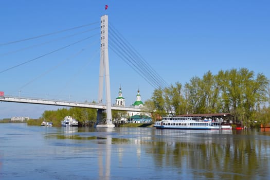 The pedestrian cable-stayed bridge on the Tura River in the city of Tyumen, Russia. May, 2016