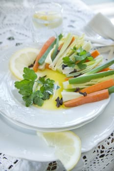 Preparation and presentation of mixed vegetables for garnish 