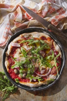 Pizza base with whole wheat flour with arugula and onion 

