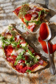 Pizza base with whole wheat flour with arugula and onion 

