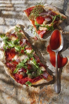 Pizza base with whole wheat flour with arugula and onion 

