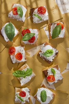 Tricolor cocktail canapes, cheese and tomato salad 