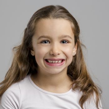 Portrait of a little girl making a happy expression