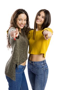 Two beautiful girls pointing