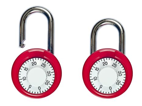 Close up of a pair of red and white combination locks..one unlocked and one locked. Isolated on white