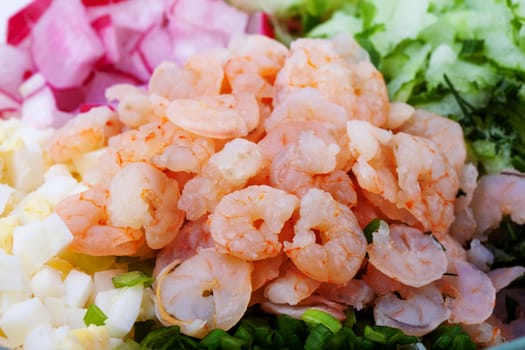 shrimps - peeled and cooked with vegetables. on a white background closeup