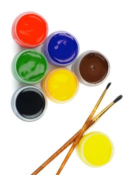 Arrangement of Watercolors Containers with Black, Green, Red, Yellow, Purple and Brown Watercolor and Paintbrushes isolated on white background. Vertical View