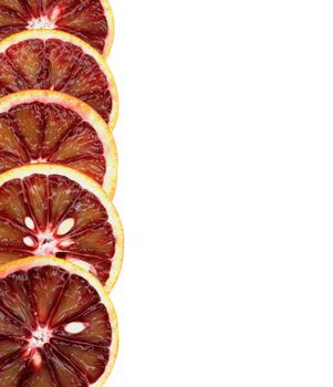 Frame of Perfect  Ripe Sliced Blood Oranges isolated on White background. Vertical View