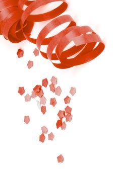 Curled Red Party Streamers and Star Shape Confetti isolated on White background