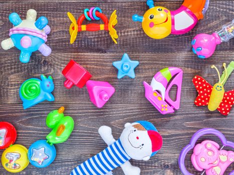 top view or flat lay on colorful toys on wooden background