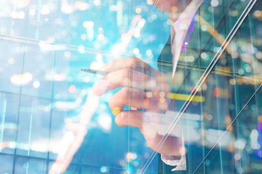 Double Exposure of Businessman writing with Building decorated with Glass