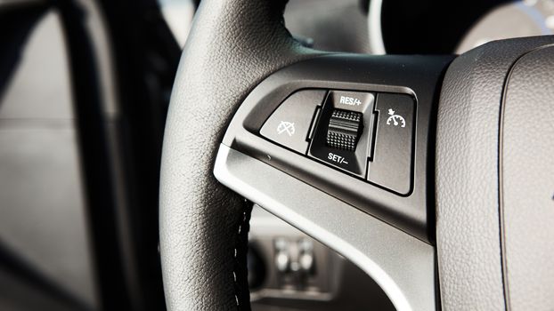 Control buttons on the steering wheel of a car