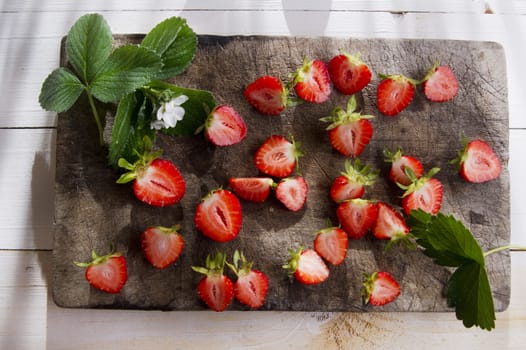 Small pieces of strawberries for the preparation of salad 